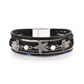 Detailed view of multilayer leather bracelet with silver sea turtle and starfish charms - Black