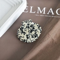 Detailed close-up of shell-shaped acetate hair claw clip with black ink splatters on cream - 8# Black White Splatter Floral