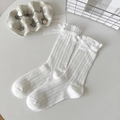 White cotton hollow-out crew socks with delicate lace trim and ribbon bow accents - One Size / Pure White