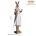 Resin rabbit figurine wearing a white and gold formal gown standing on a white background - Formal Suit Male Rabbit