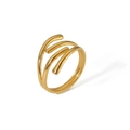 Macro view showing the triple-layer wrap-around design of the polished gold steel ring - Gold Irregular Criss Cross Ring