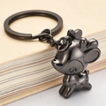 Cute black metal deer keychain with glossy gun-black finish and a round spotted body - Lucky Deer / Black