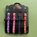 Set of four colorful silicone pet collars with fishbone pattern and bells on display cards - Fish Bone / 4Pcs Set
