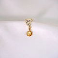 Gold heart earrings with amber beads and sparkling crystals on white silk background - Heart Rhinestone Amber Bead Pendant