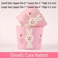 Pink cupcake paper mold with white heart patterns and a cute cartoon rabbit design - Silly Rabbit