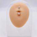 Silver stainless steel belly button ring with flower-shaped clear zircon stones on model - Elegant Zirconia Flower