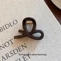 Chocolate brown twist hair claw clip with glossy finish and 6cm length specification - 10# Chocolate Color Approximately 8cm