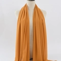 Ginger yellow chiffon hijab scarf for women displayed on a white mannequin torso - 6