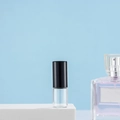 Clear glass roller bottle with black cap on display for perfume and essential oil samples - 2ml Black