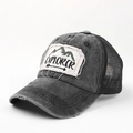 Detail of vintage washed grey trucker hat featuring Explorer embroidery and mesh back - Adjustable / Black