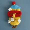 Handmade crochet sausage mouth key case in yellow featuring a blue hat and silver ring - Popcorn with Blue Hat