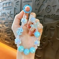 Girly blue crystal beaded chain keychain with butterfly bow and dollar sign pendant. - Blue
