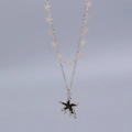 Zilveren gelaagde ketting met zwarte sterhanger en kleine sterretjes in liquid lava stijl - Zilverkleurige dubbellaagse ketting met sterren en zwarte sterhanger (Witgoud verguld 2099)
