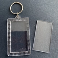 Clear acrylic rectangle photo frame keychain with metal ring on leather background - Rectangle 6.7x3.9cm