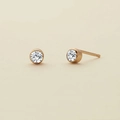 Minimalist gold bezel set stud earrings featuring round cubic zirconia crystals - April White - Gold
