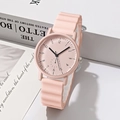 Detailed view of pink student quartz watch with wavy texture silicone strap on soft background - Pink