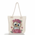 Detail of beige canvas tote with thick rope handles and colorful floral owl print - Floral Crown Owl & Butterfly