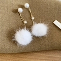 Detailed shot of winter drop earrings featuring plush fur balls and white pearls - White Pom Pom Pearl Style / Silver Pin-Gold-White