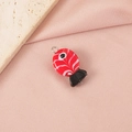 Detailed view of a handmade red glass clownfish bead with swirl patterns and metal loop - Red & Black Striped Fish Single Loop (4#) / Steel
