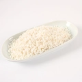 Realistic white fake nut sprinkles for DIY cake decoration in a ceramic dish - Shredded Coconut / 500g