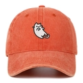 Close-up of vintage washed brick red baseball cap featuring detailed white cat embroidery - Orange