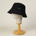 Close-up of black quilted cotton bucket hat with a small metallic logo bar on the side - M (56-58.5cm) / Black