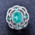 Macro shot of Paraiba blue pear-cut ring with micro-pave diamonds and vintage details - Adjustable Open / Style A-Lake Blue Oval Hollow