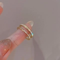 Detail of gold double-layered ring with zircon inlays and mother-of-pearl finish - Double-layer Open Ring / One Size / Gold