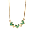 Elegant gold necklace with three connected green crystal heart pendants on box chain - Green