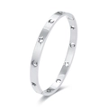 Bracciale rigido in acciaio inox argento con motivi traforati a stella e luna su bianco - Argento