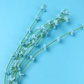 Detailed view of handmade light blue crochet flowers with green stems on matching background - Single Blue Liriope Flower Stem - Green Stalk