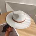 White wool fedora hat with brown leather rivet band on a wooden table with shadows - Adjustable / White