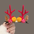 Christmas hair clips featuring red velvet antlers, yellow pom poms, and pine cones - Red Pine Cone Pom Pom