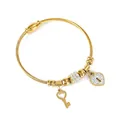 Bracelet torsadé doré avec breloques serrure et clé en cœur serties de zircons brillants - Cadenas cœur