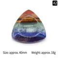 Polished 7 Chakra energy stone in triangular shape with colorful layered minerals - Triangular Thumb Stone