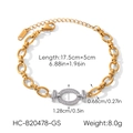 Macro view of gold and silver cuban chain bracelet with pavé crystal oval centerpiece - Bracelet (HC-B20478-GS) / Gold and Silver