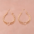 Close-up of golden hollowed wing earrings on a soft pink satin fabric background - Imitation Gold (11639)