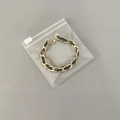 Gold and black woven chain bracelet in a clear PVC resealable jewelry organizer bag - 30 Micron 8x8cm Zipper / 100 Pcs/Pack