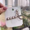 Golden hairpin featuring elegant pearls and sparkling rhinestones on a white card - Pearl Duckbill Clip