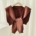 Knitted shawl scarf in coffee brown with ribbed texture on a wooden clothes hanger - Coffee