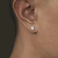 Classic silver six-prong cubic zirconia stud earrings worn on ear for men's trendy fashion - 6-Prong Zircon Stud / 8mm Single