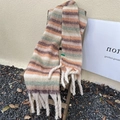 Striped mohair scarf in brown, orange, and green with long fringe on a wooden chair - Beige Horizontal Stripe