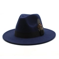 Close-up of navy blue wool fedora hat featuring black ribbon and decorative feathers - Navy Blue