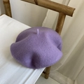 Classic purple wool beret with top stem detail shown on a minimalist white chair - M(56-58cm) / Purple