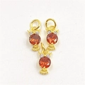 Detailed view of three golden owl pendants with orange round stones and small zircons - Pendant Only / Red