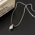 Detail of a polished silver teardrop pendant on a sleek snake chain with a dark backdrop - Snake Chain Water Drop Necklace (48+5cm)