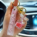 Milk tea cup keychain with liquid glitter, purple unicorn and pink wristband strap - Red