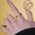 Golden open ring with shell clover flower pendant shown on model with macro detail - White Shell Clover Style (696)