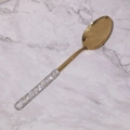 Golden stainless steel spoon with rhinestone handle on marble surface detail - Dinner Spoon / Gold