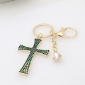 Detail of gold keychain with green rhinestone cross and clear teardrop crystal pendant - Green